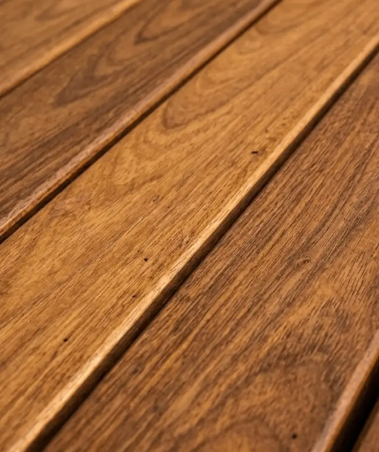 Cumaru tropical hardwood boards showcasing natural grain and golden brown color Cumaru tropical hardwood boards showcasing natural grain and golden brown color